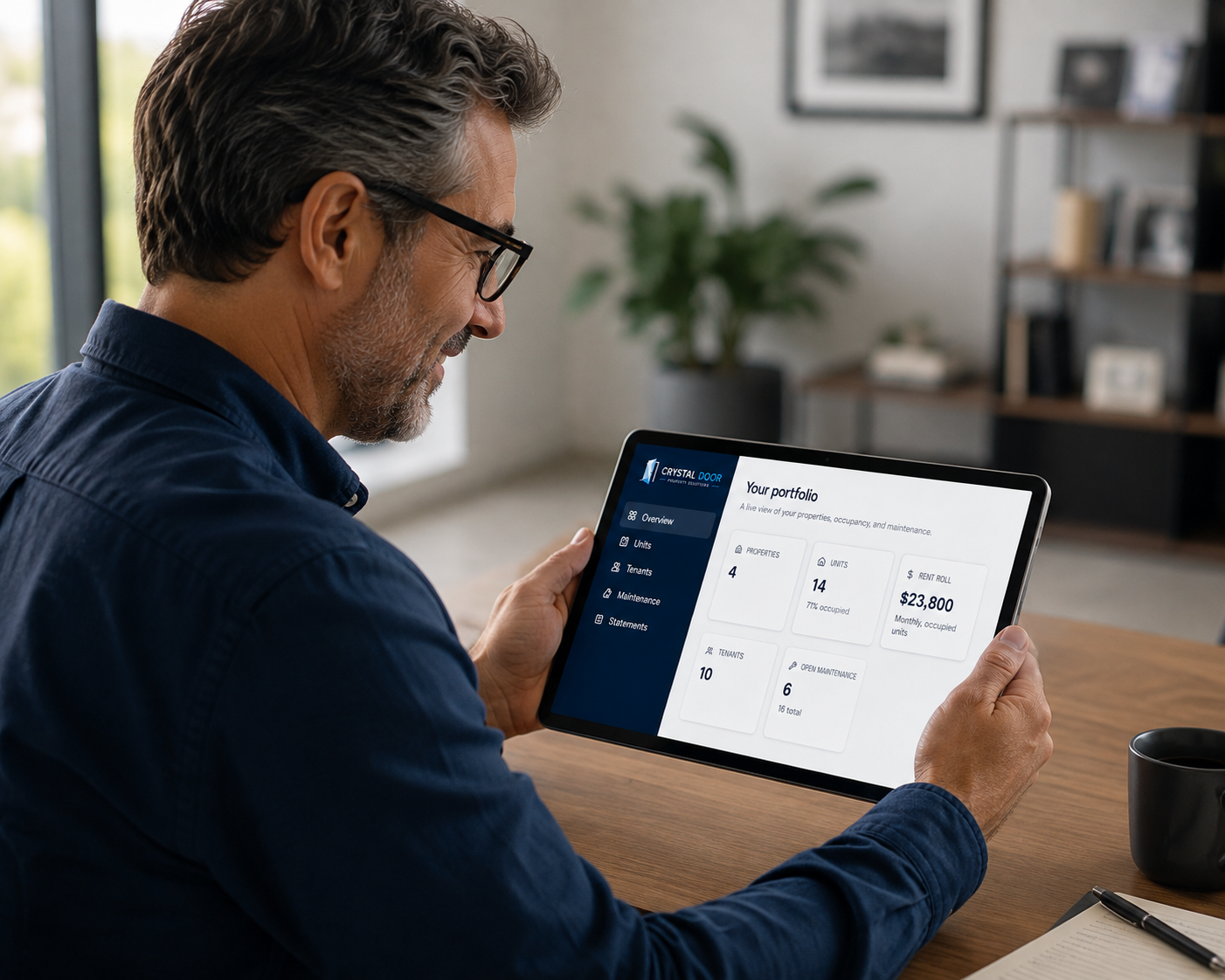 Property owner reviewing a live portfolio dashboard on a tablet